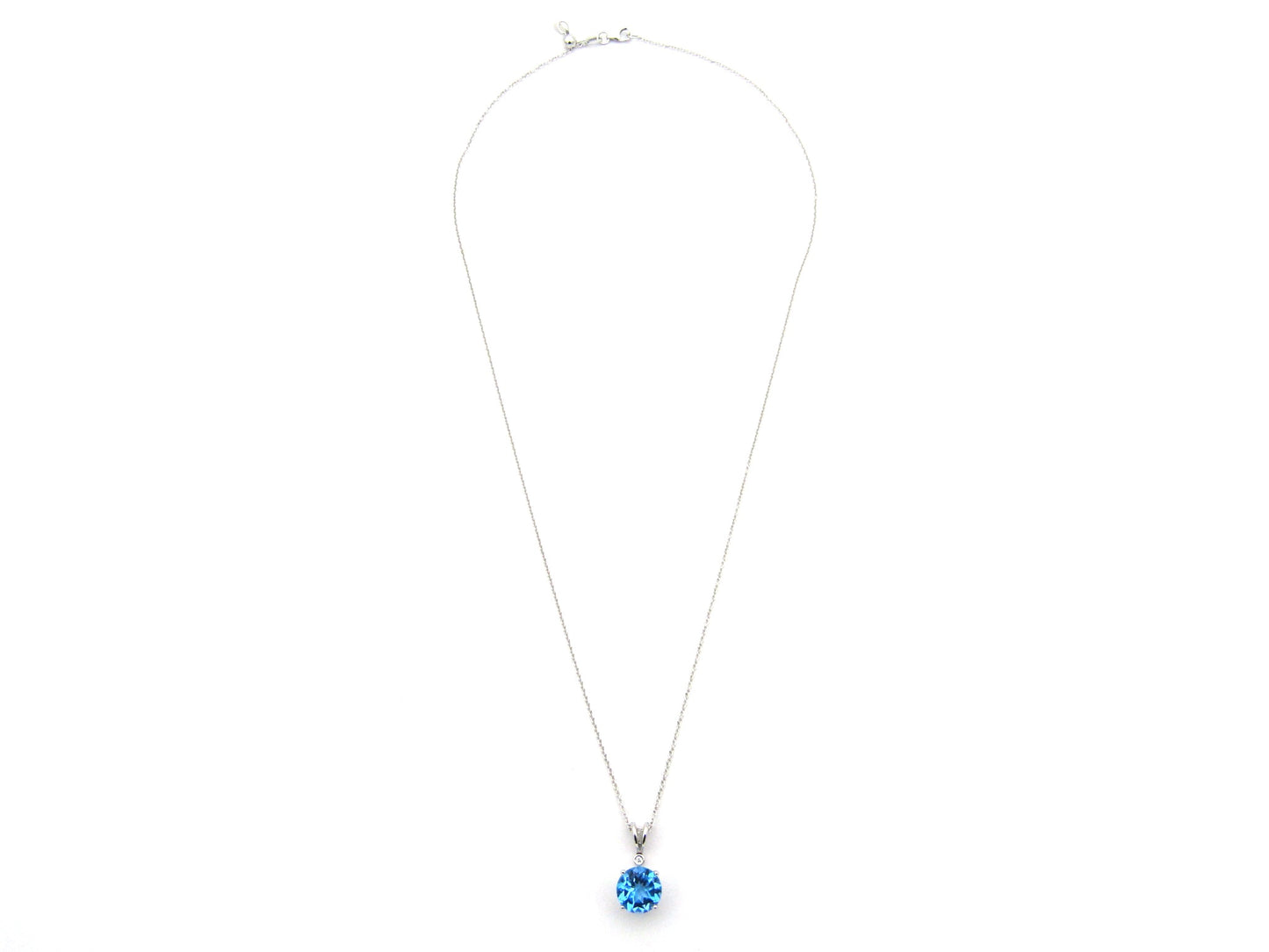 9K gold blue topaz and diamond pendant.