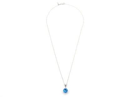 9K gold blue topaz and diamond pendant.