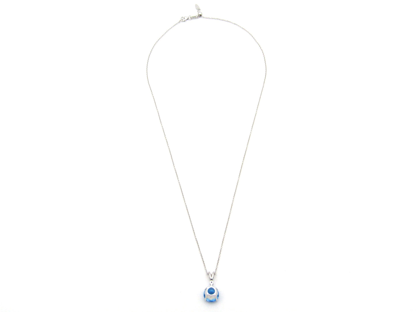 9K gold blue topaz and diamond pendant.