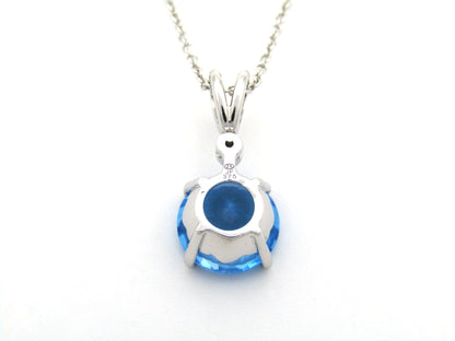 9K gold blue topaz and diamond pendant.