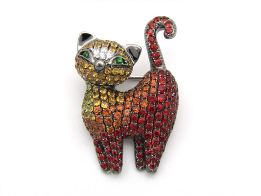 18K gold fancy sapphire, tsavorite garnet and diamond cat pendant/brooch.