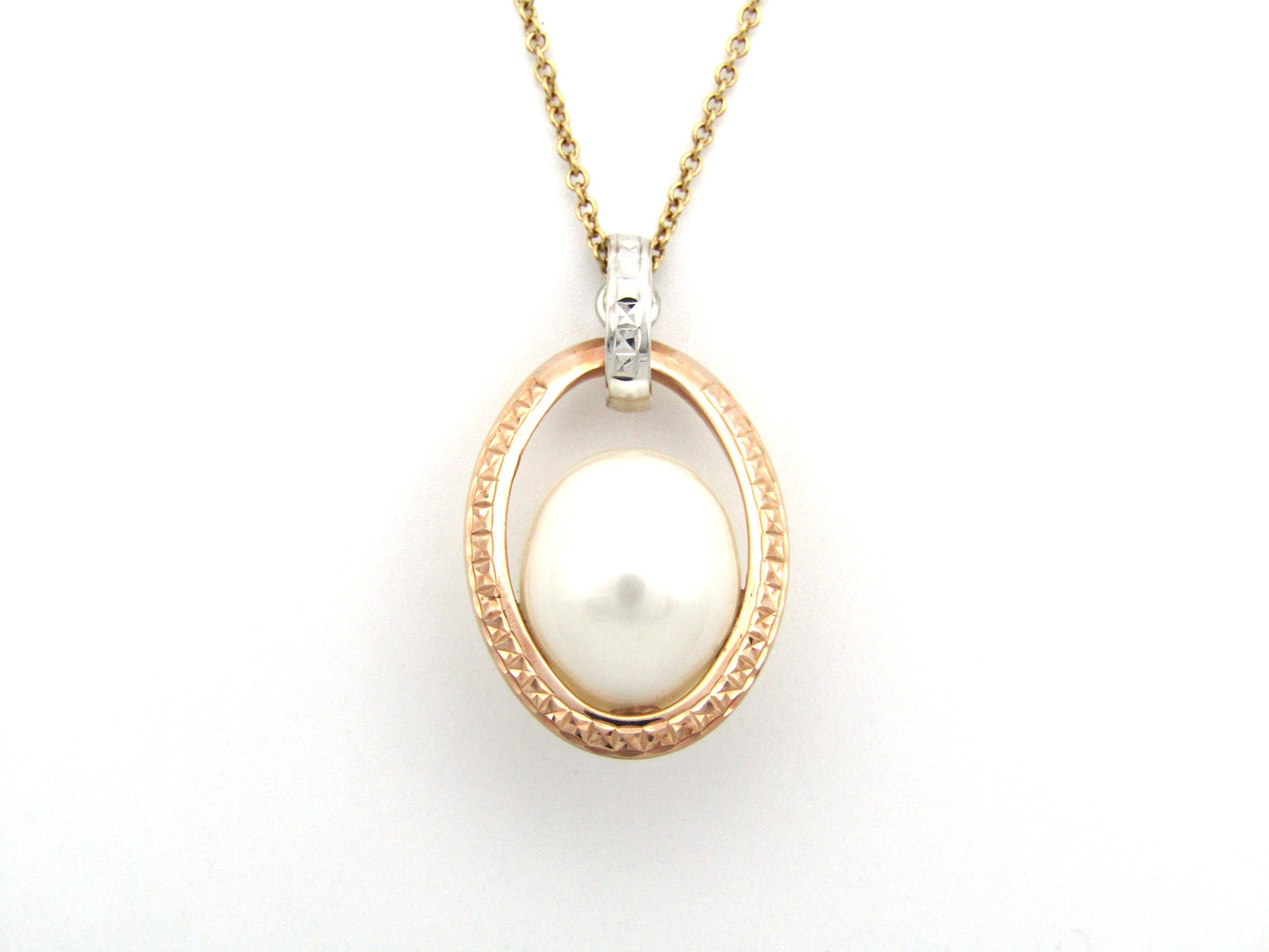 18K tri-gold freshwater pearl pendant with 18K gold chain.