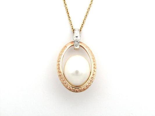 18K tri-gold freshwater pearl pendant with 18K gold chain.