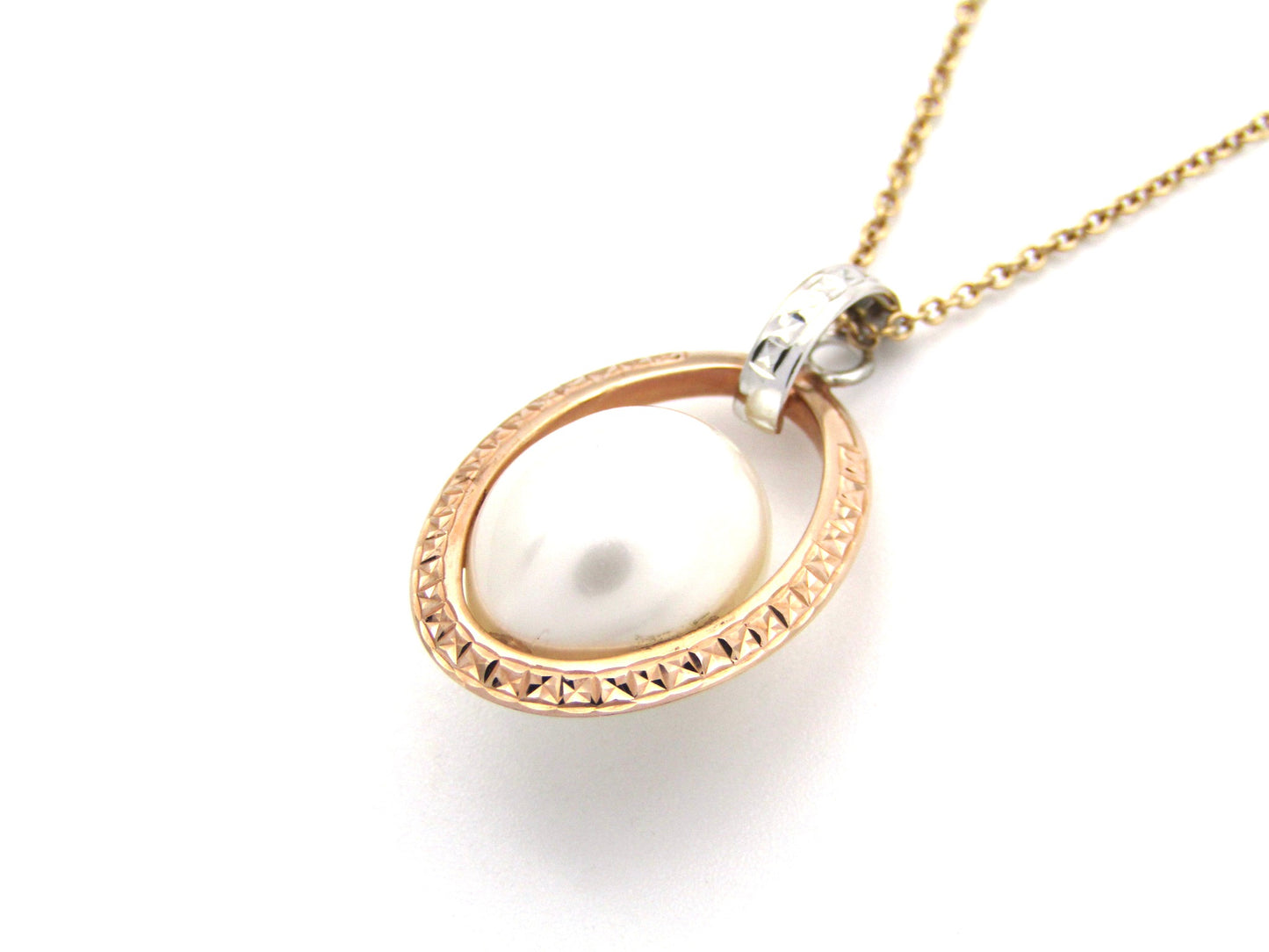 18K tri-gold freshwater pearl pendant with 18K gold chain.