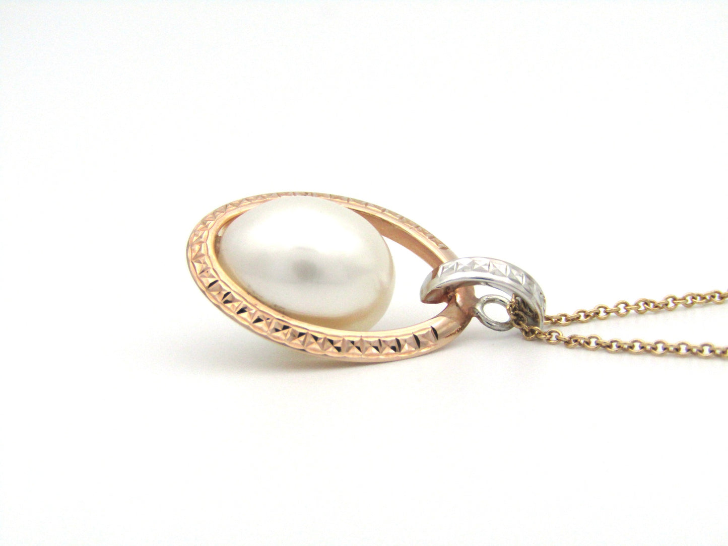18K tri-gold freshwater pearl pendant with 18K gold chain.