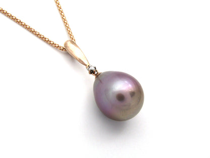 9K gold freshwater pearl and diamond pendant with 18K gold chain.
