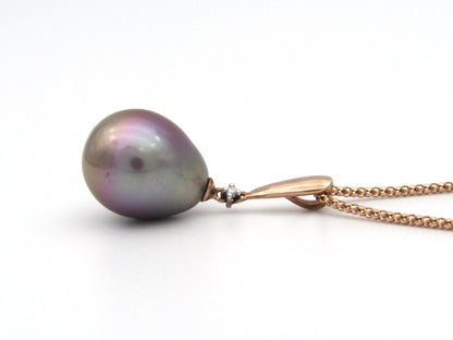 9K gold freshwater pearl and diamond pendant with 18K gold chain.