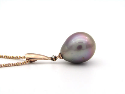 9K gold freshwater pearl and diamond pendant with 18K gold chain.
