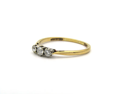 18K gold & platinum Three-stone diamond Edwardian ring, circa 1900.