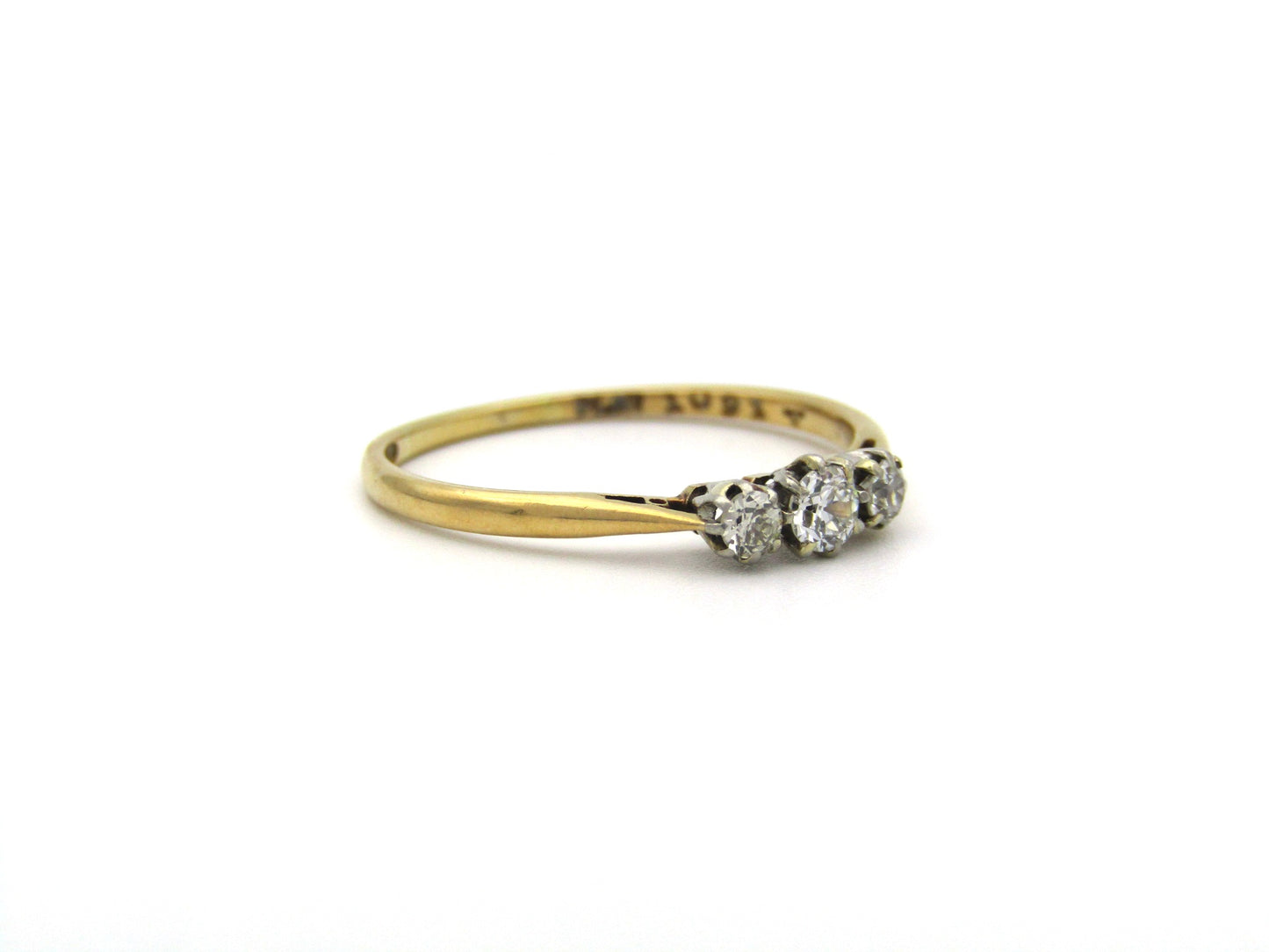 18K gold & platinum Three-stone diamond Edwardian ring, circa 1900.