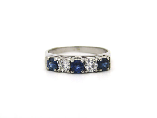 18K gold half eternity sapphire and diamond ring.