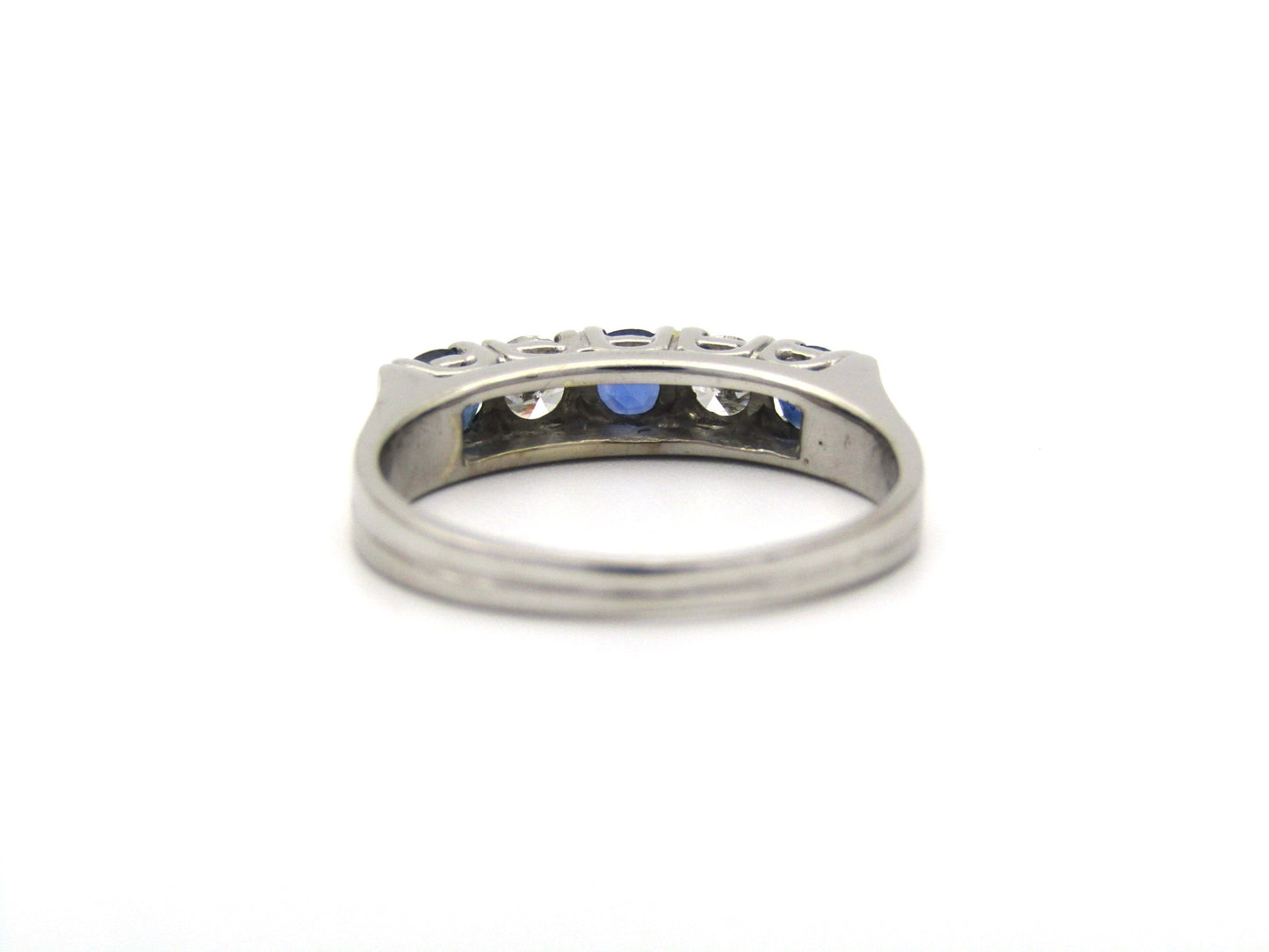 18K gold half eternity sapphire and diamond ring.