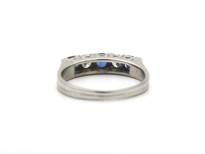 18K gold half eternity sapphire and diamond ring.