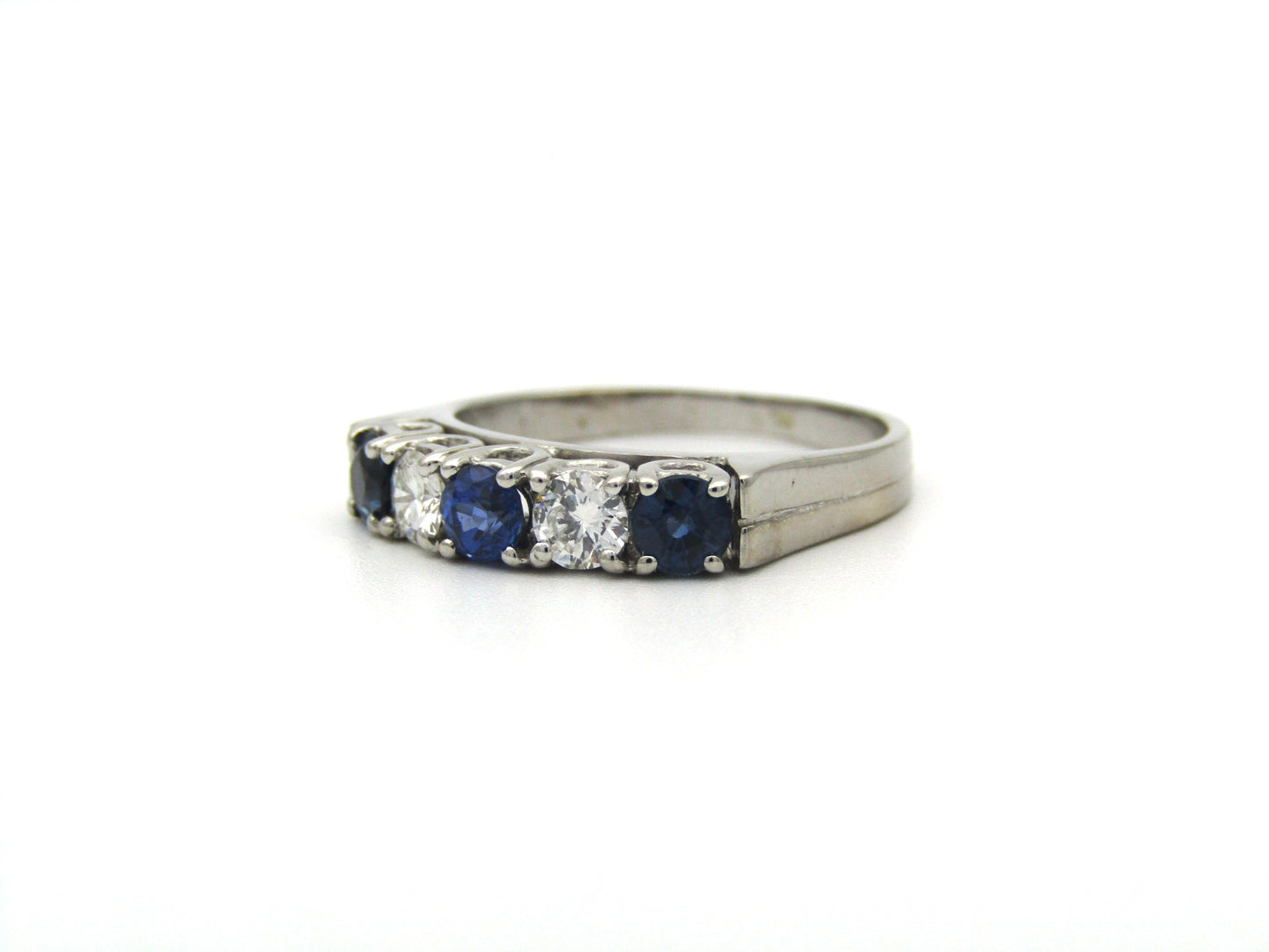 18K gold half eternity sapphire and diamond ring.