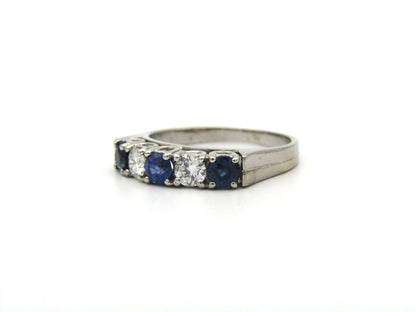 18K gold half eternity sapphire and diamond ring.