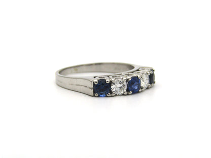 18K gold half eternity sapphire and diamond ring.
