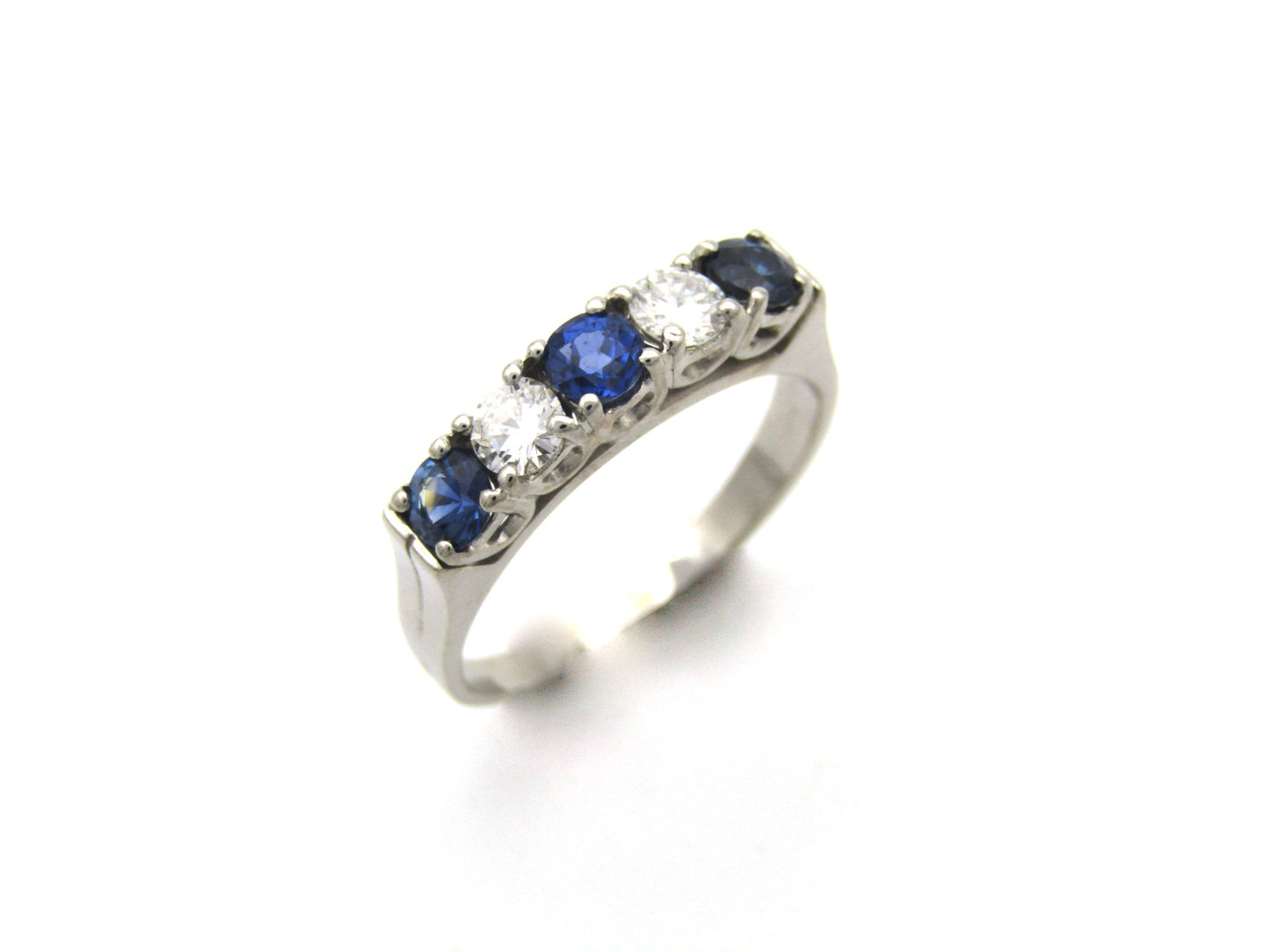 18K gold half eternity sapphire and diamond ring.