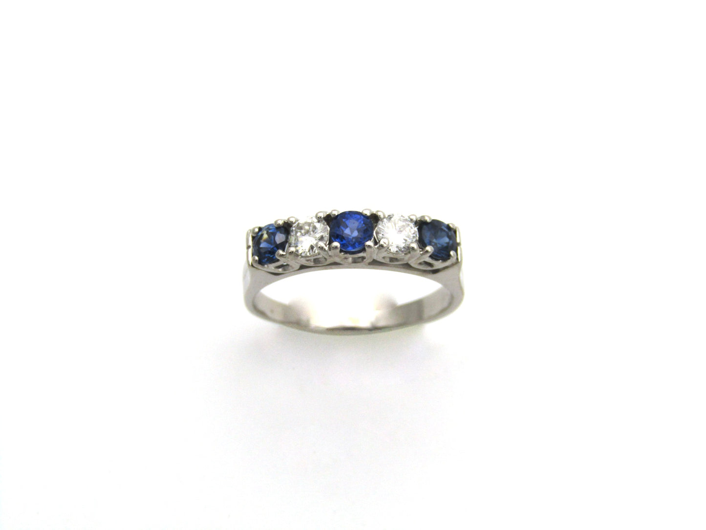 18K gold half eternity sapphire and diamond ring.