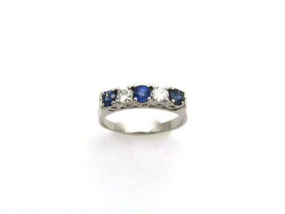 18K gold half eternity sapphire and diamond ring.