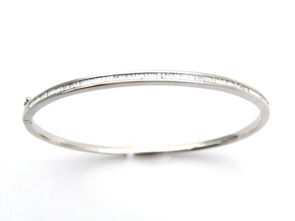 18K gold diamond bangle.