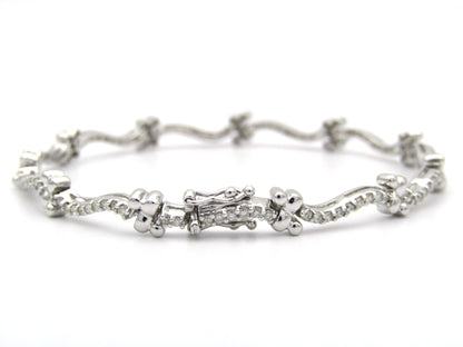 18K gold diamond wave link bracelet.