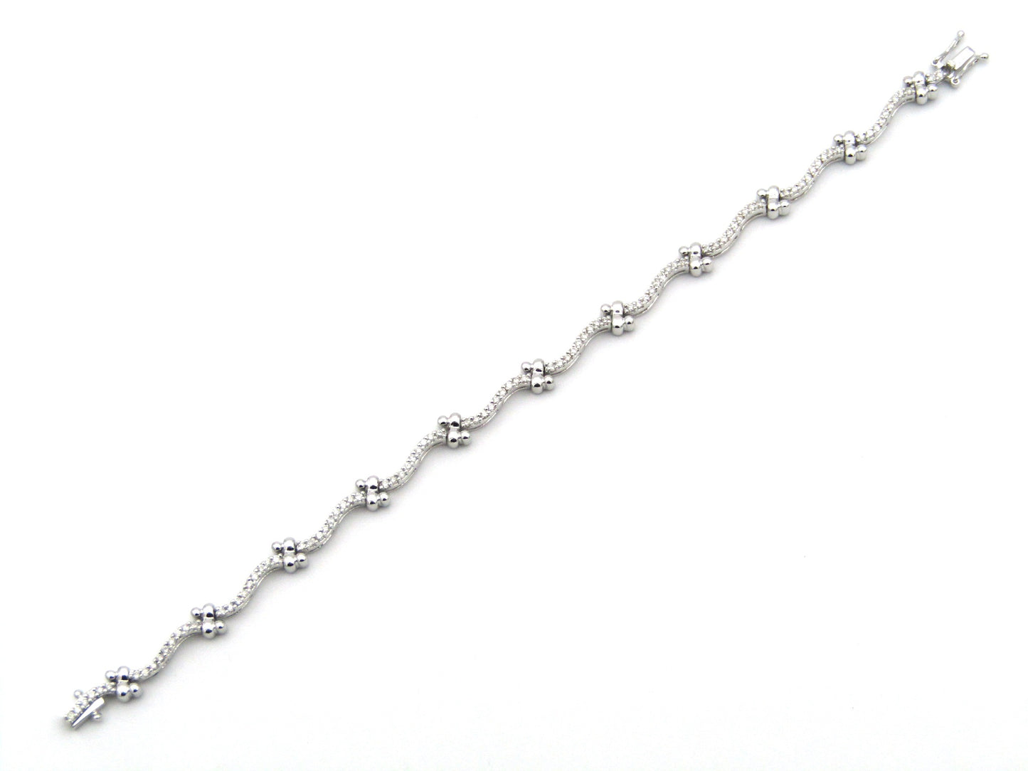 18K gold diamond wave link bracelet.