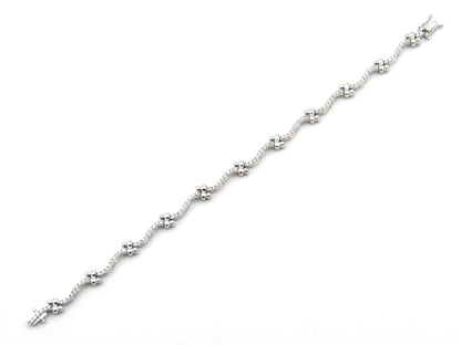 18K gold diamond wave link bracelet.