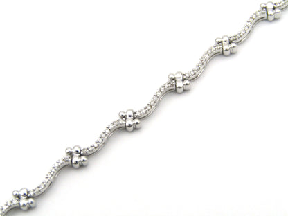 18K gold diamond wave link bracelet.