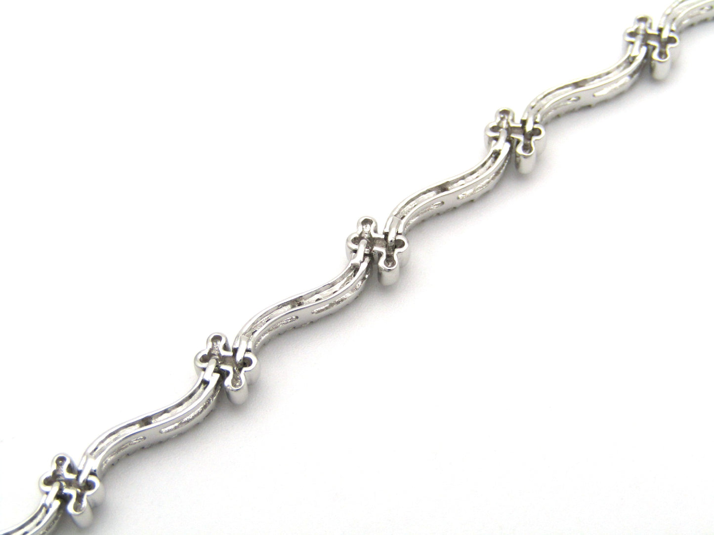 18K gold diamond wave link bracelet.