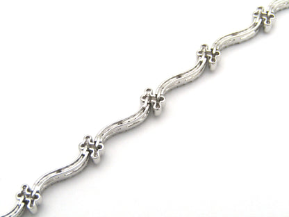 18K gold diamond wave link bracelet.