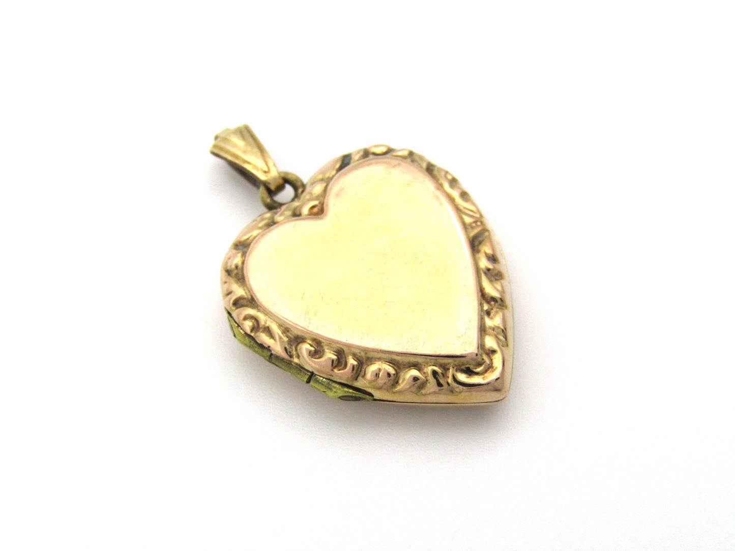 9K gold Edwardian heart locket, circa 1900.