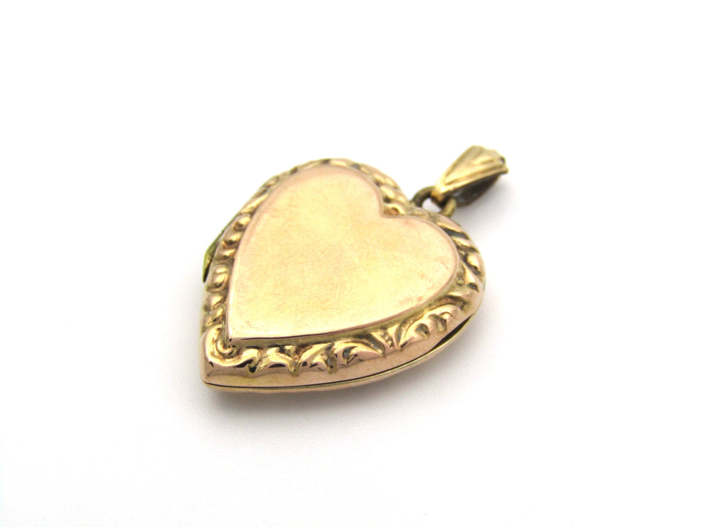 9K gold Edwardian heart locket, circa 1900.