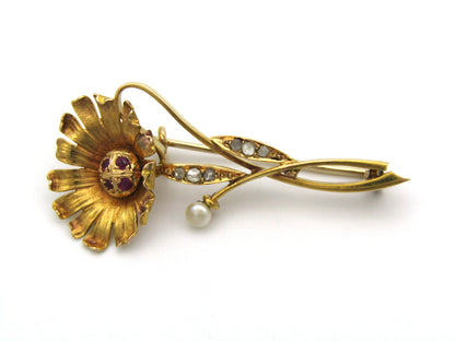 22K gold Edwardian ruby, diamond, and pearl sunflower brooch, circa 1900.