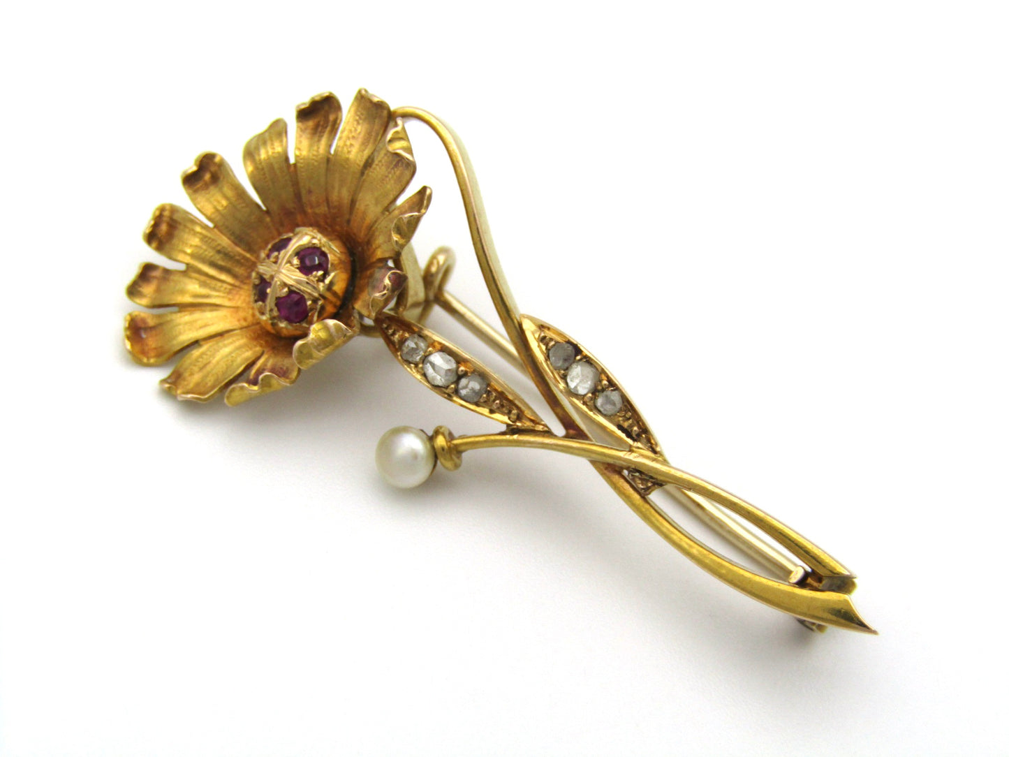 22K gold Edwardian ruby, diamond, and pearl sunflower brooch, circa 1900.