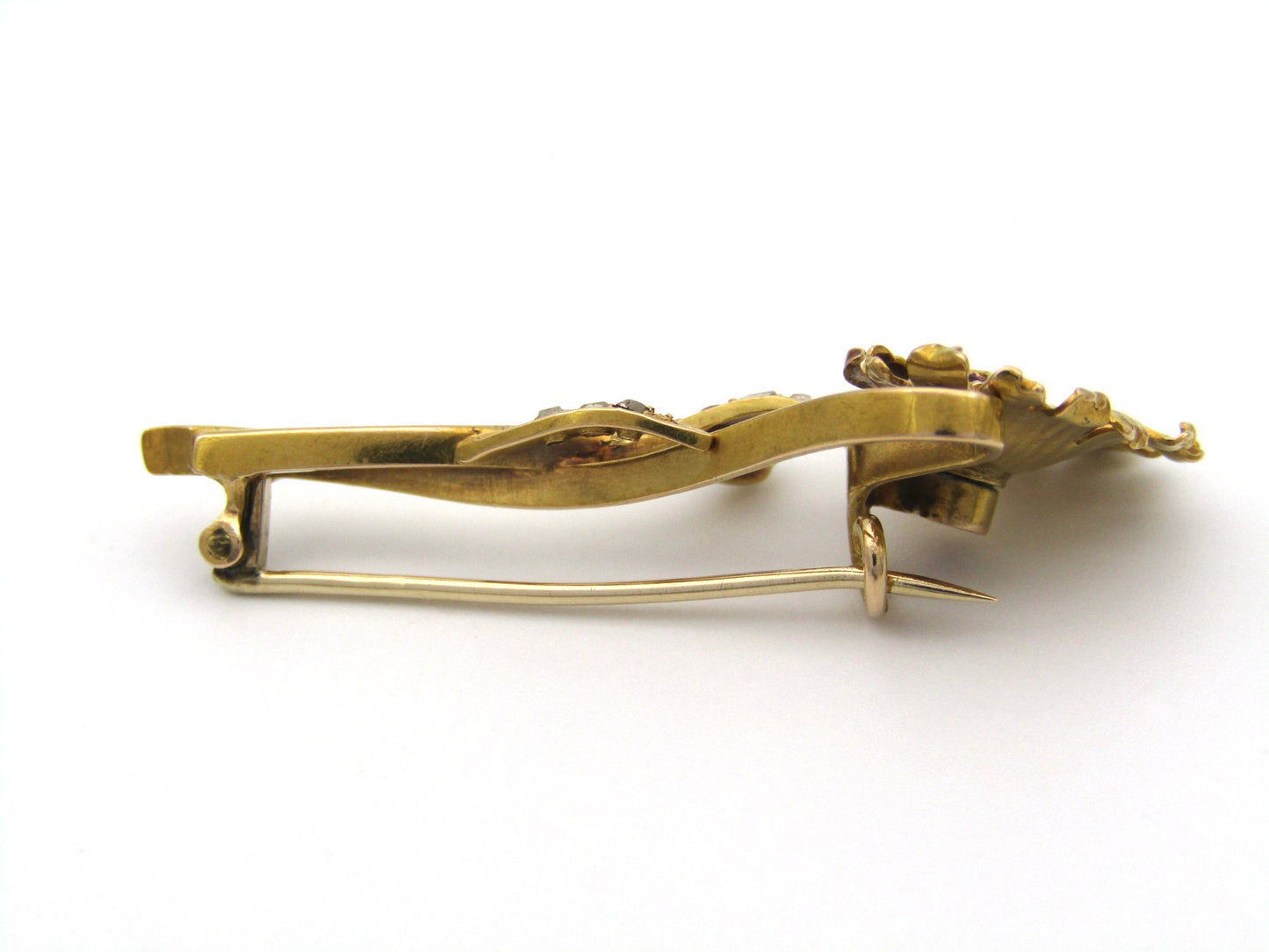 22K gold Edwardian ruby, diamond, and pearl sunflower brooch, circa 1900.