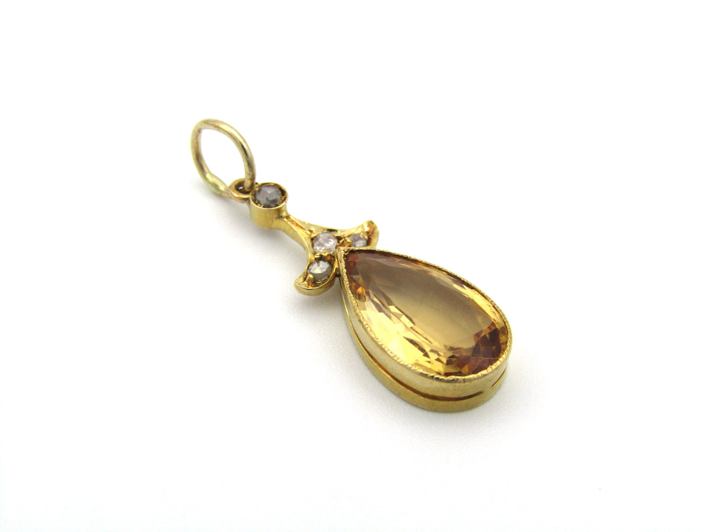 18K gold Edwardian topaz and diamond pendant, circa 1900.