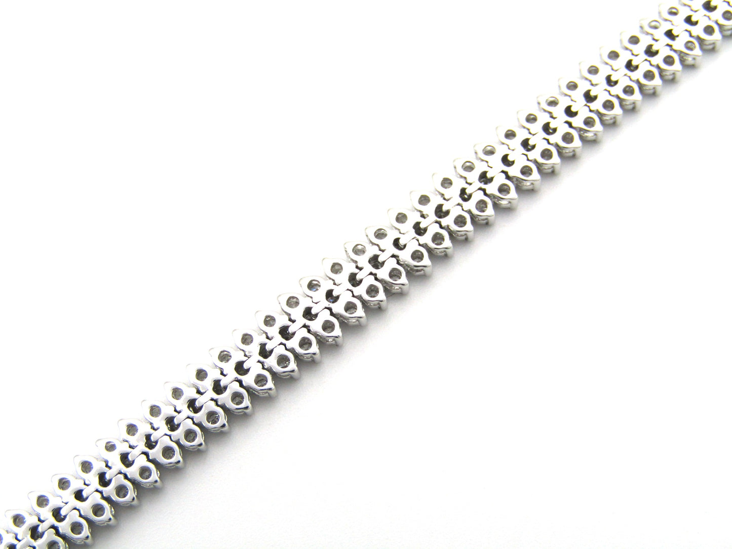 18K gold triple row diamond tennis bracelet.