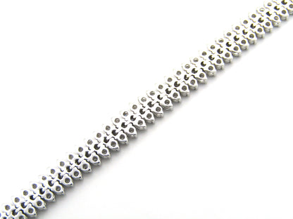 18K gold triple row diamond tennis bracelet.