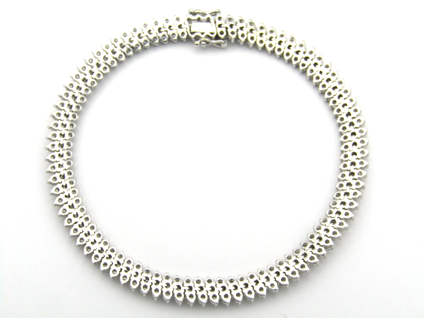 18K gold triple row diamond tennis bracelet.