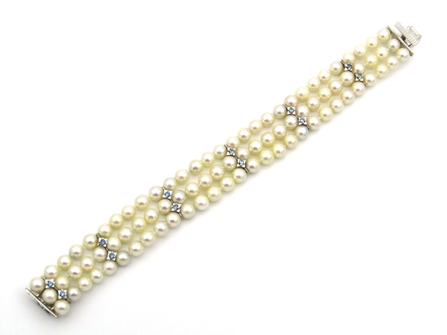 18K gold three-strand akoya cultured pearl bracelet, circa 1980's.