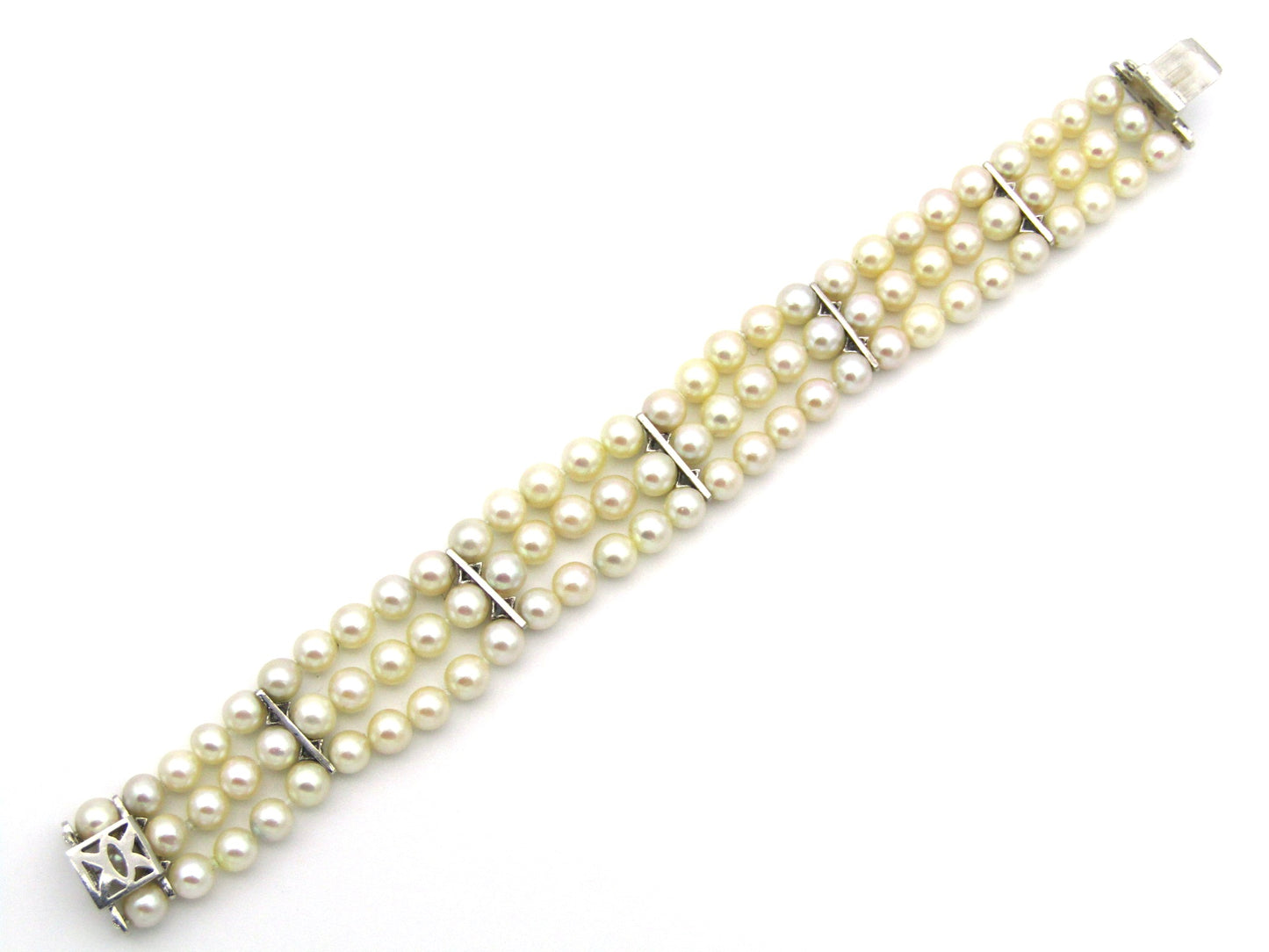 18K gold three-strand akoya cultured pearl bracelet, circa 1980's.