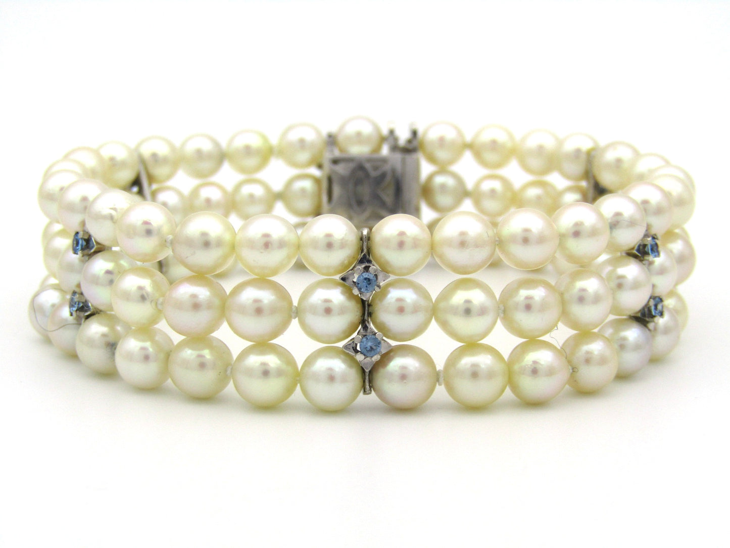 18K gold three-strand akoya cultured pearl bracelet, circa 1980's.