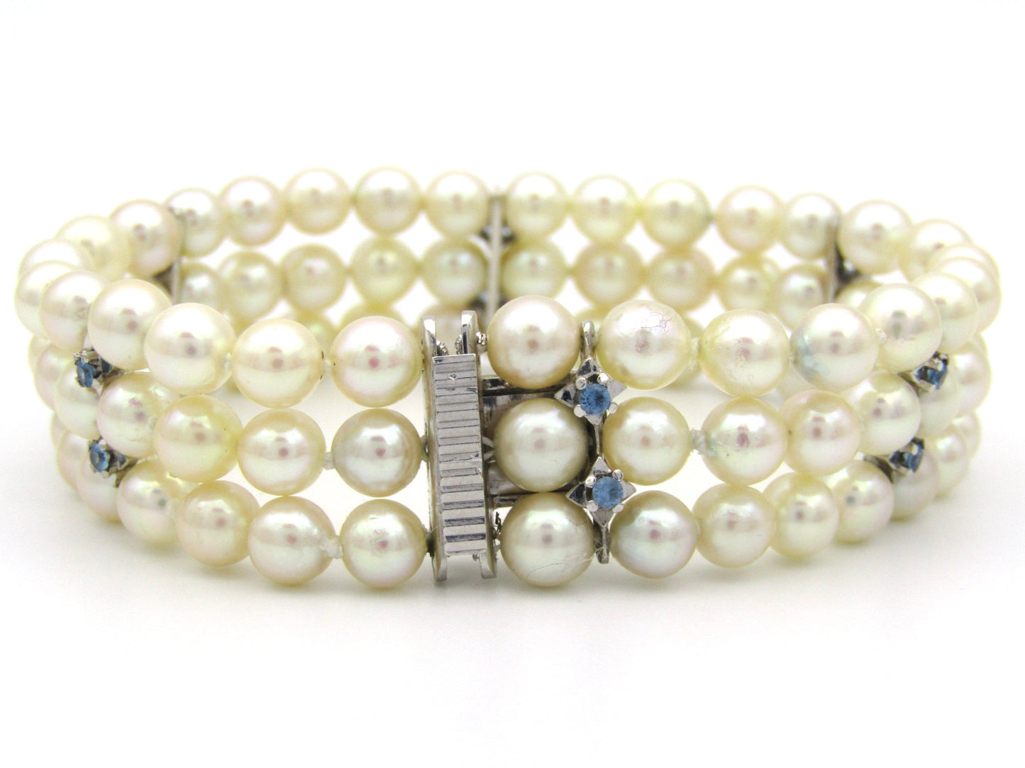 18K gold three-strand akoya cultured pearl bracelet, circa 1980's.