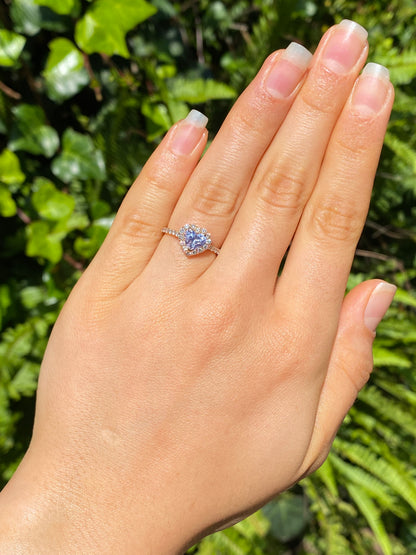 18K gold heart-shaped diamond halo ring.