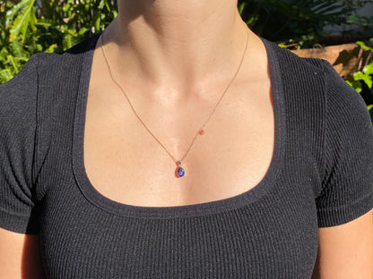 18K gold tanzanite pendant with 18K gold chain.