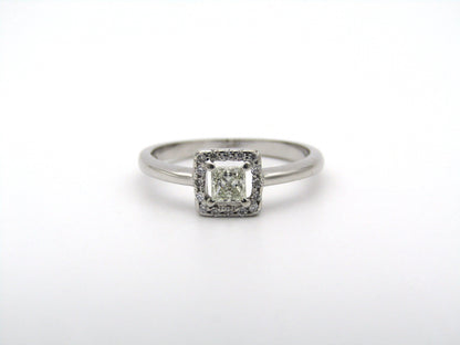 18K gold diamond halo ring.