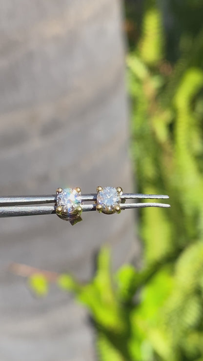 18K gold diamond stud earrings.