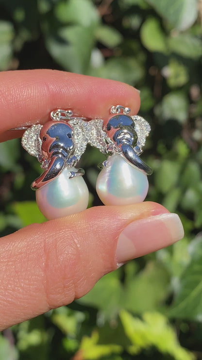 14K gold baroque pearl and diamond elephant earrings.
