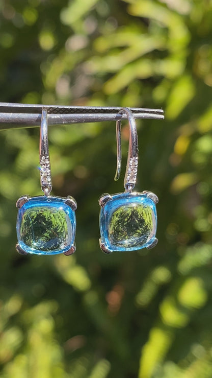 14K gold blue topaz and diamond drop earrings.