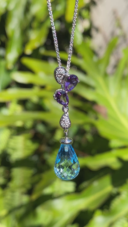 18K gold blue topaz, amethyst, and diamond pendant.